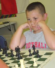 Student thinking at the Karpov Chess School