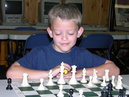 Student studies chess at Karpov Chess School